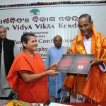 Swamini offering Arsha Vidya Vacaspati Title to Prof. Prafulla Kumar Mishra