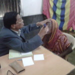 Dr. Amar Bikram Mohanty examining a patient