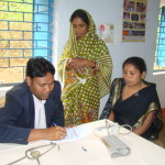 Dr. Amulya Kumar Nayak attending to a patient