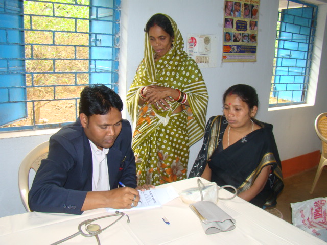 Dr. Amulya Kumar Nayak attending to a patient