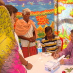 Dr. P C Mohanty attending to a patient