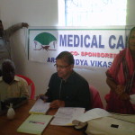 Dr. P C Mohanty attending to patients