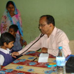 Dr. S N Kar attending to a patient