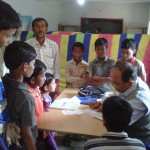 Dr. S N Kar, Paediatriciian surrounded by children