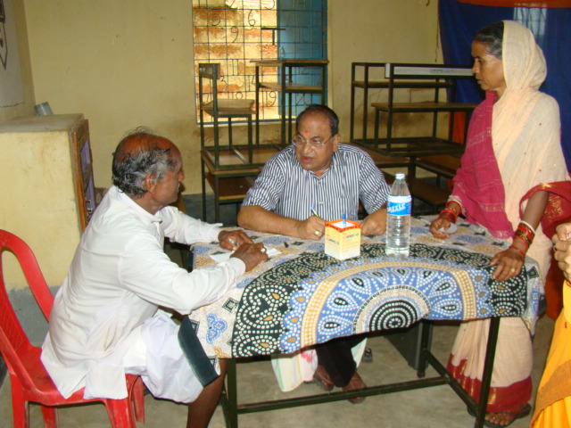 Prof. Dharanidhara Mishra attends to a patient