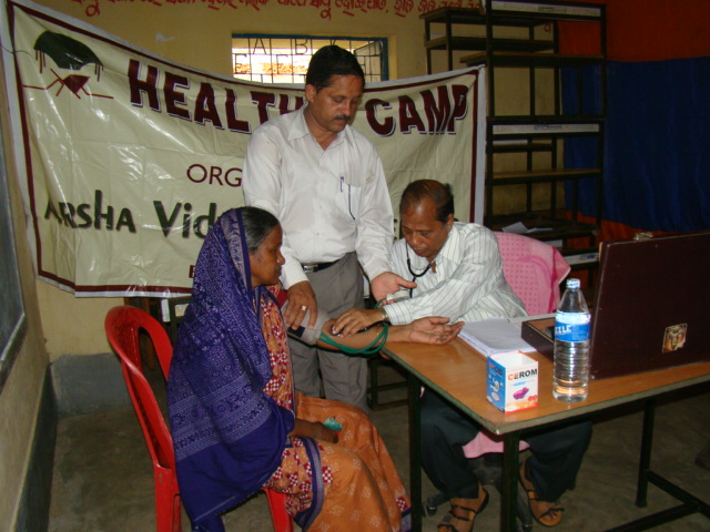 Prof. R N Sahoo attends to a patient