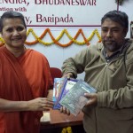 A Poet gifting his books to Swamini