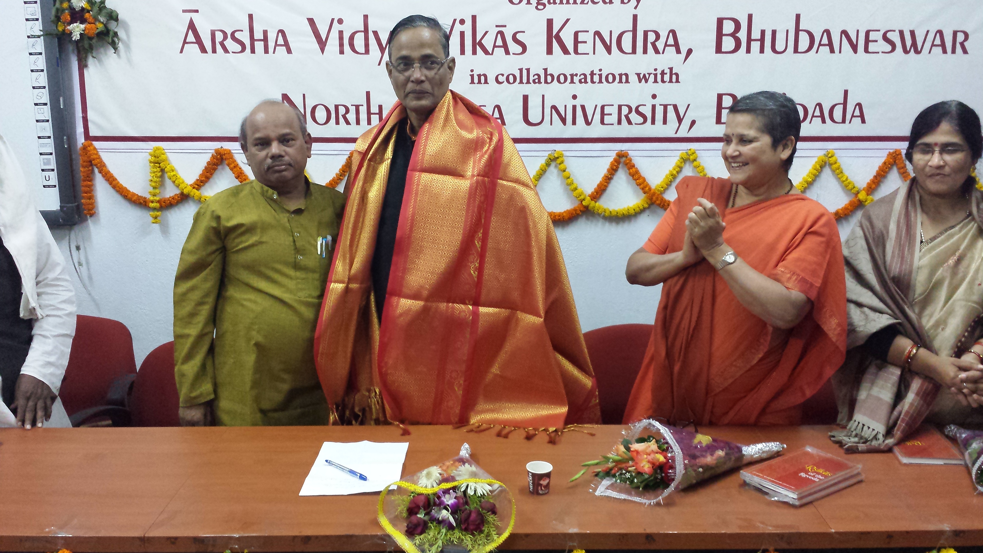 Prof. Godabarisha Mishra presenting a Shawl to Prof. Prafulla K Mishra, VC, NOU